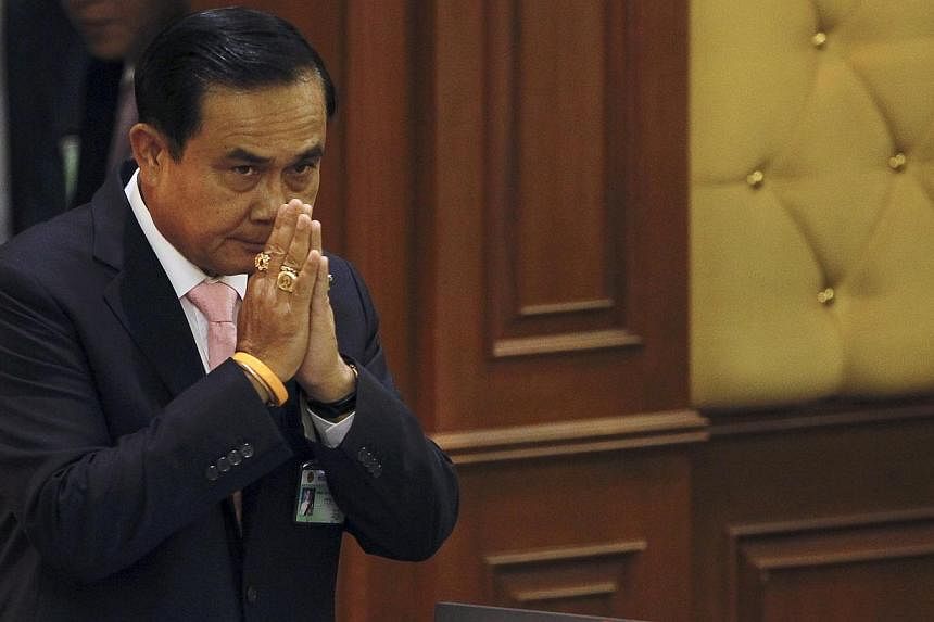 Thailand's Prime Minister Prayuth Chan-o-cha gestures in a traditional greeting to National Legislative Assembly members at the parliament in Bangkok, Thailand, on May 21, 2015. -- PHOTO: REUTERS