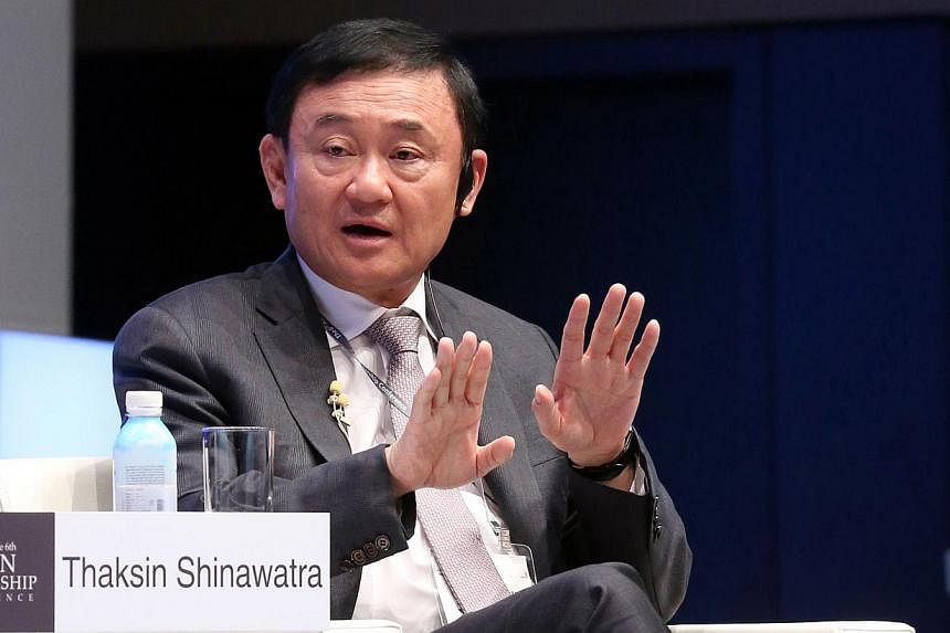 Former premier Thaksin Shinawatra speaking at the Asian Leadership Conference in Seoul on May 19, 2015. Thailand's foreign ministry on Wednesday, May 27, said it had cancelled the fugitive former premier's passports because he was deemed to have "end
