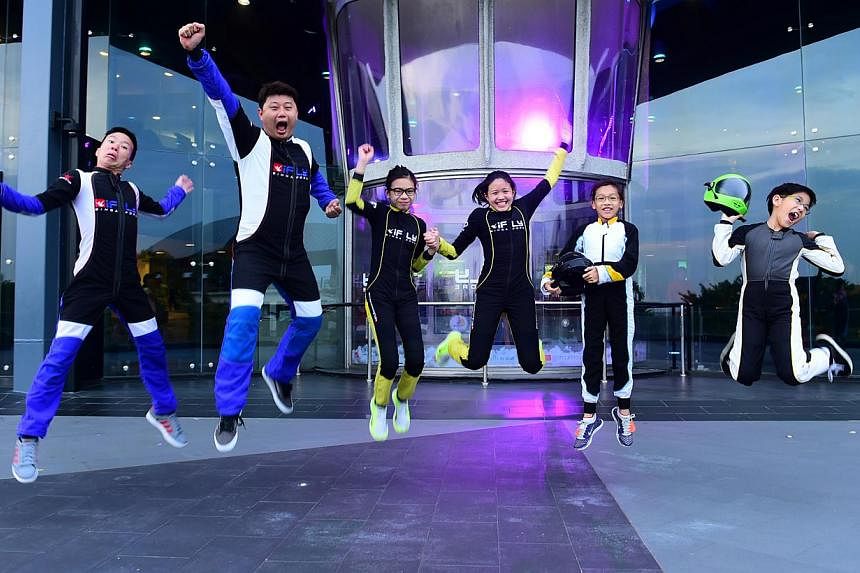 The iFly Singapore team consisting of (from left) Jonathan Loh, Lawrence Koh, Kyra Poh, Choo Yi Xuan, Lye Yu Xuan and Jordan Lee. The team broke five Guinness World Records on May 21, 2015. -- PHOTO: IFLY SINGAPORE&nbsp;