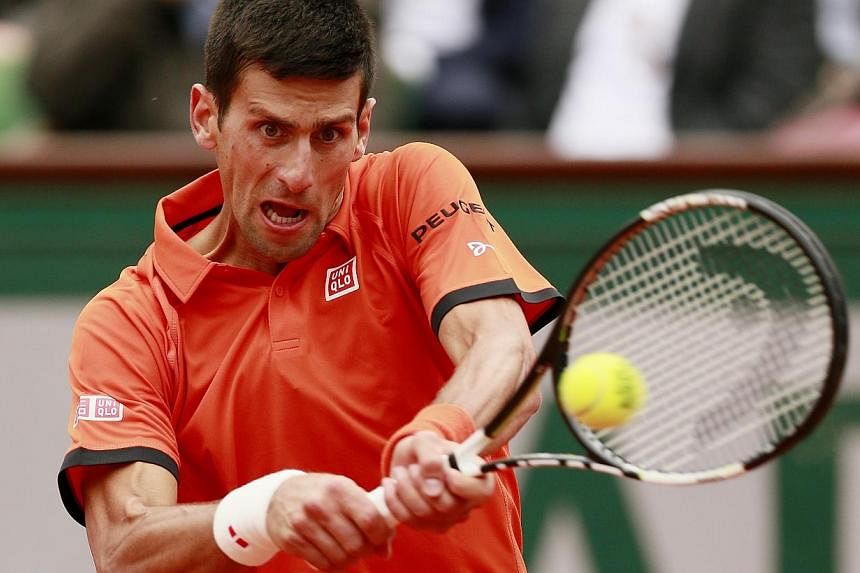 Serbia's Novak Djokovic in action during the first round of the French Open at&nbsp;Roland Garros in Paris. -- PHOTO: REUTERS