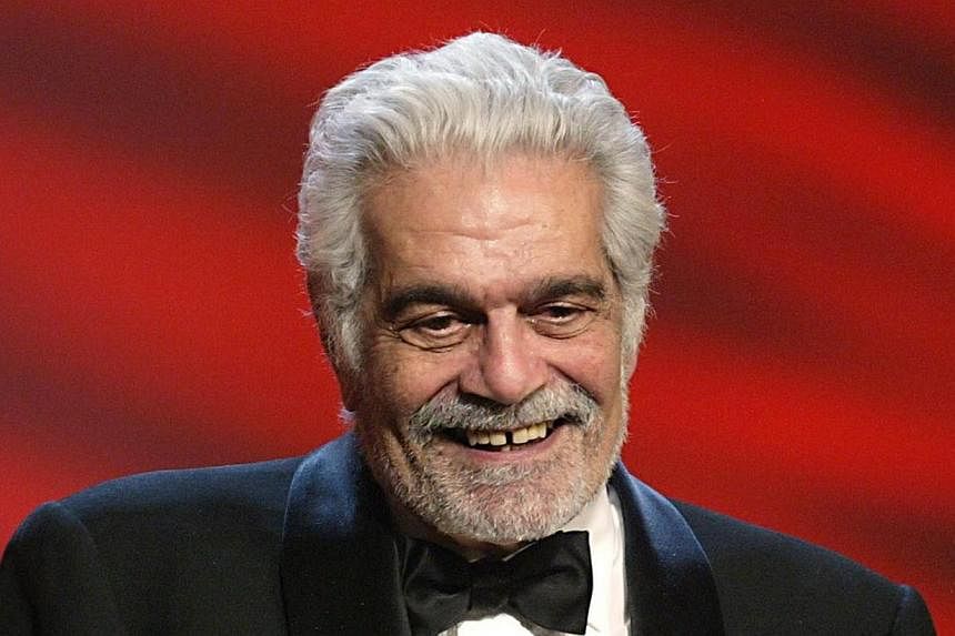 Egyptian born actor Omar Sharif smiles after being awarded as Best actor during the 29th Nuit des Cesars at the Chatelet theatre in Paris in this 2004 file photo. -- PHOTO: AFP