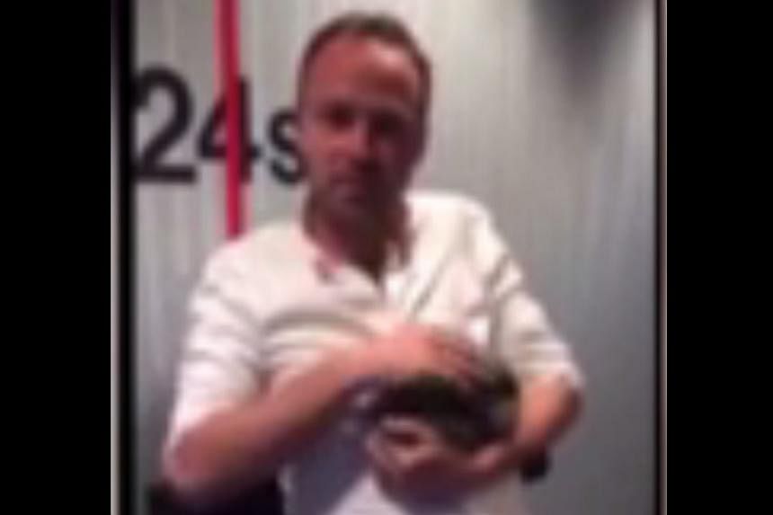 Danish radio host Asger Juhl cradles baby rabbit Allan before beating him to death with a bicycle pump on his show. -- PHOTO: YOUTUBE