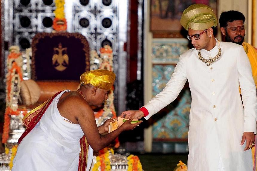 An Indian priest performing rituals during a coronation ceremony for the royal orient Yaduveer Krishnadatta Chamaraja Wadiyar at Amba Vilas Palace in Mysore, India on May 28, 2015. -- PHOTO: EPA
