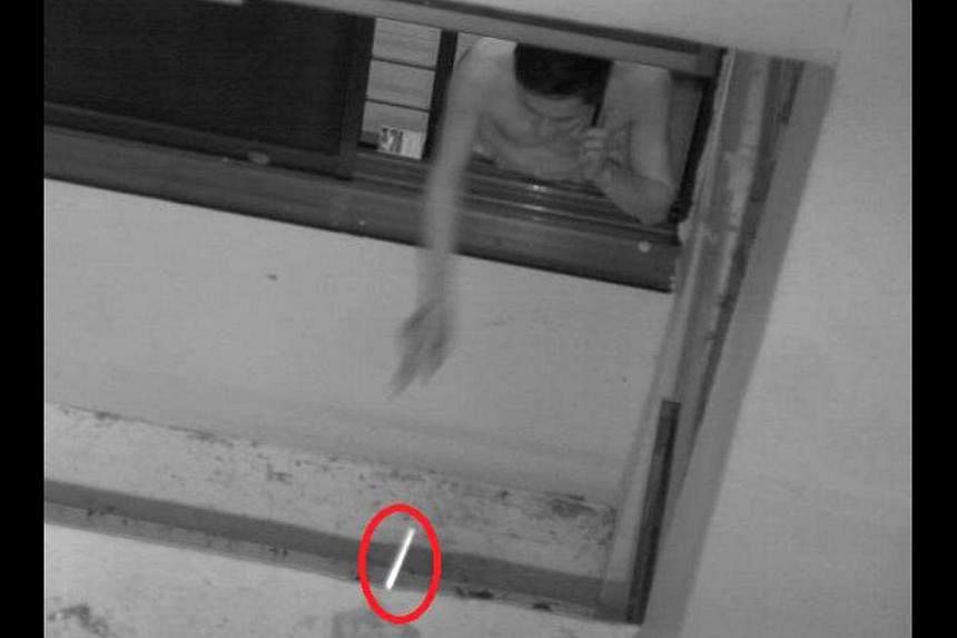 A man caught on camera throwing a cigarette butt out of the window at his home in Sengkang in January this year. According to tender documents, the new cameras will be deployed temporarily to monitor certain flats.