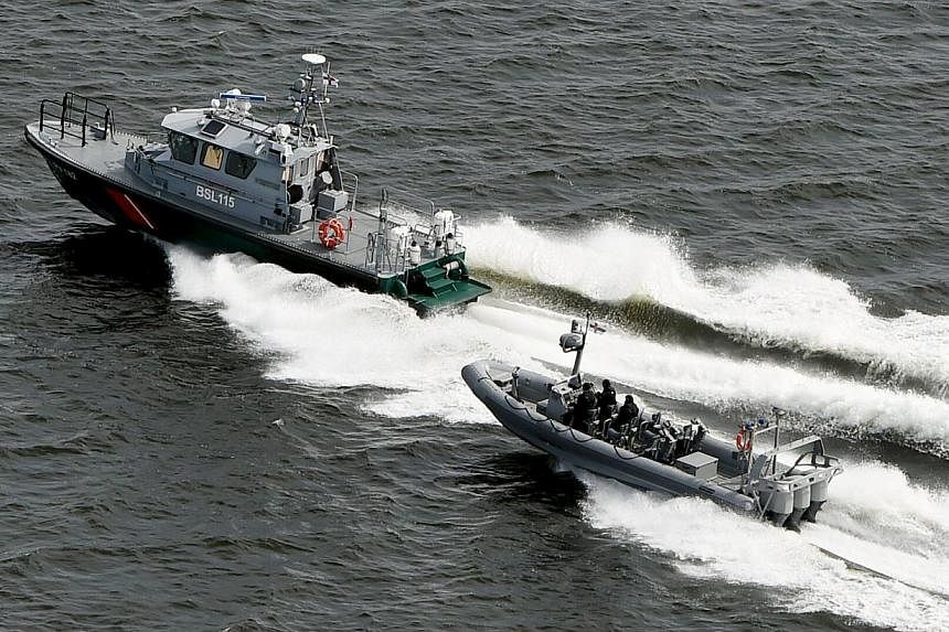 Finnish Border Guard boats patrol the waters near Helsinki on April 28, 2015.&nbsp;The Finnish Border Guard said on Thursday, May 28, that it had not been able to confirm the presence of a suspected submarine near Helsinki last month. -- PHOTO: REUTE
