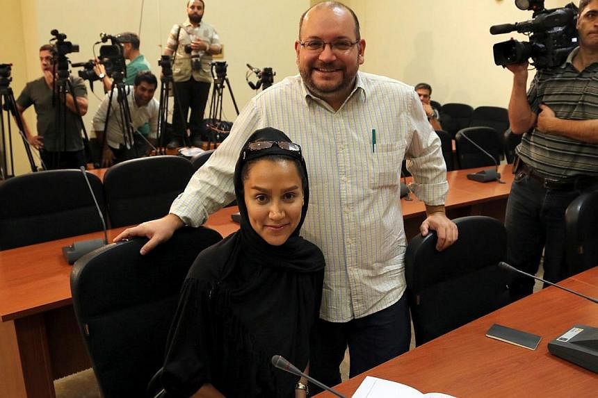 A file picture dated Sept 10, 2013, shows Washington Post Iranian-American journalist Jason Rezaian and his Iranian wife Yeganeh Salehi during a press conference in Teheran, Iran. -- PHOTO: EPA