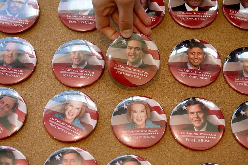 Campaign buttons featuring Republican presidential hopefuls are seen on display during the 2015 Southern Republican Leadership Conference on May 21, 2015 in Oklahoma City, Oklahoma. -- PHOTO: AFP