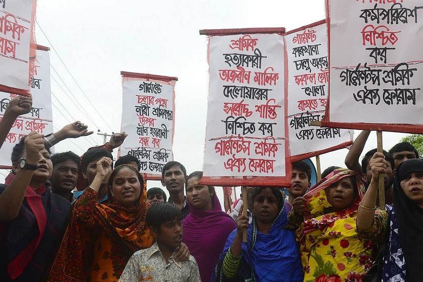 Memebers of the Bangladeshi garments worker union shout slogans as they mark the second anniversary of the Rana Plaza building collapse at the site where the building once stood in Savar, on the outskirts of Dhaka, on April 24, 2015.&nbsp;Two garment