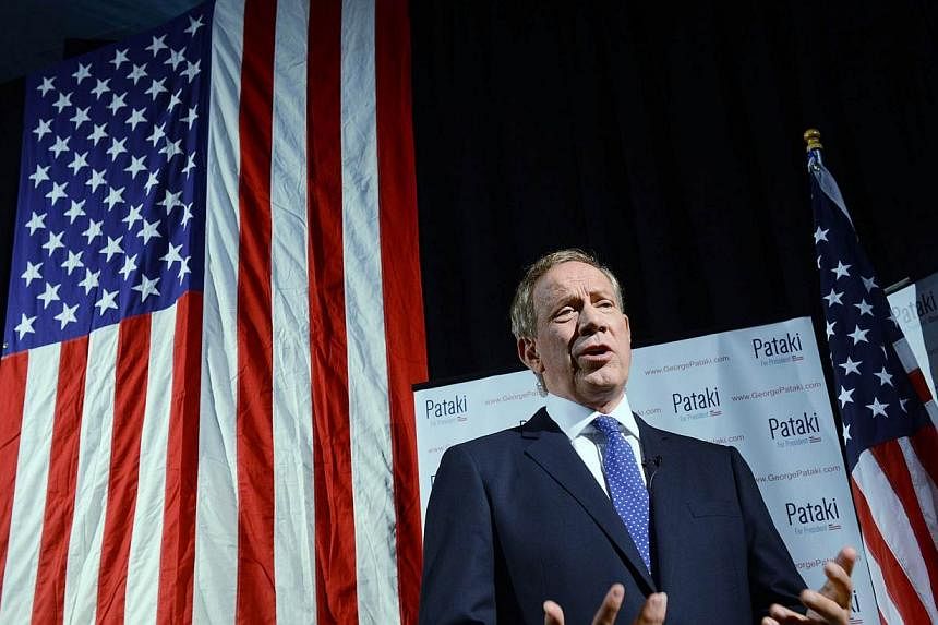 Former New York Gov. George Pataki is interviewed by the media prior to announcing his candidacy for the 2016 Republican presidential nomination on May 28, 2015 in Exeter, New Hampshire.&nbsp;-- PHOTO: AFP&nbsp;
