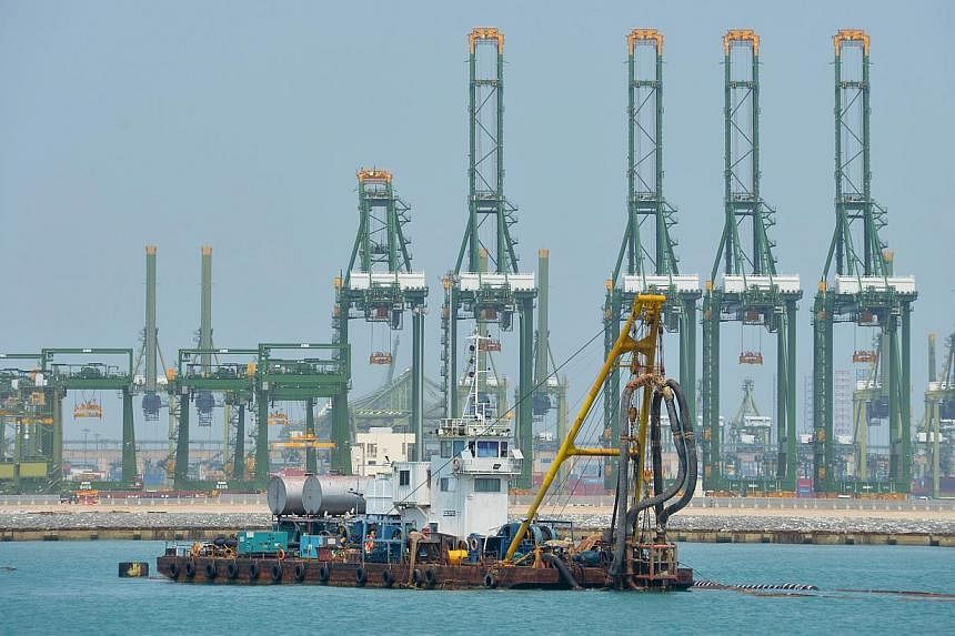 Future maritime trade routes such as Artic shipping lanes could challenge Singapore's position as a global shipping hub, but boosting efficiency and capacity will help the Republic's port stay competitive and relevant.&nbsp;-- PHOTO: ST FILE