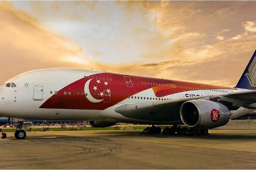 Singapore Airlines (SIA) is celebrating the nation's Golden Jubilee by having two Airbus 380s in a special livery, featuring a large Singapore flag-themed design on the fuselage. -- PHOTO: SINGAPORE AIRLINES