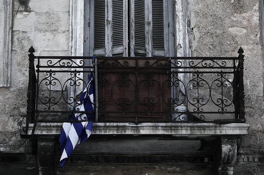 Greece's exit from the eurozone is a possibility but would not signify an end to the single currency, International Monetary Fund chief Christine Lagarde said in a newspaper interview Thursday. -- PHOTO: AFP