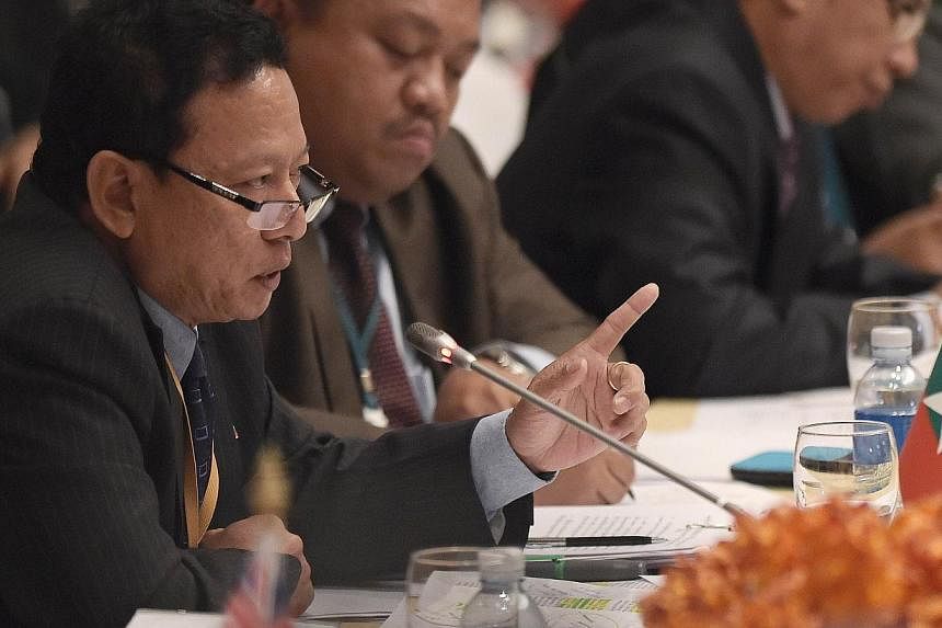 Myanmar's Foreign Ministry Director-General Htin Lynn speaking during an international meeting on migration in the Indian Ocean attended by delegates from 17 nations in Bangkok on May 29, 2015. -- PHOTO: AFP