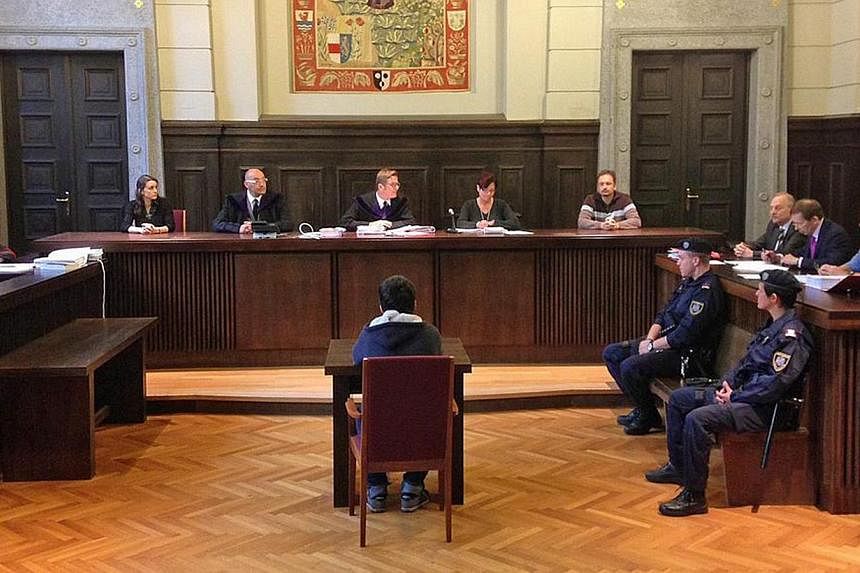 Police guarding the courtroom before the start of a trial of a teenager for allegedly supporting ISIS, in Vienna, Austria, on Tuesday. Meanwhile, a 14-year-old (right) was sentenced to eight months' jail for plans to join ISIS extremists in Syria, an