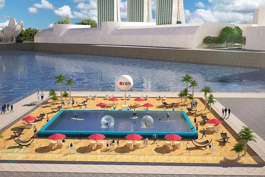 &nbsp;An artist's impression of the first urban beach here, which will be set up at The Promontory @ Marina Bay on June 13 and 14. It measures 50m by 50m and is made from 28,000kg of sand. -- PHOTO: DBS