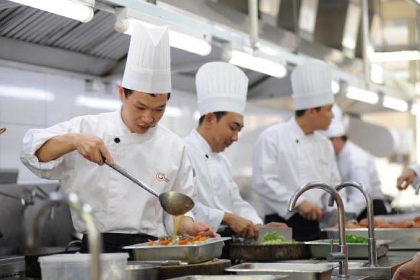 Chefs working in a central kitchen of Neo Group, a food and catering company.&nbsp;--&nbsp;PHOTO: NEO GROUP LIMITED
