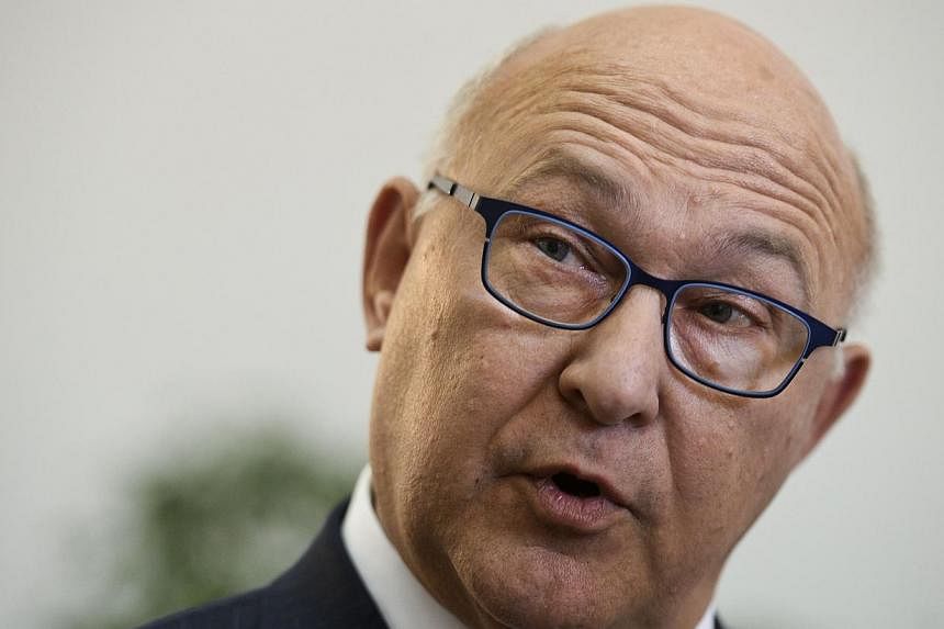 French finance minister Michel Sapin speaks to the press after a meeting with his Portuguese counterpart at the Portuguese Finance Ministry in Lisbon on May 23, 2015. -- PHOTO: AFP &nbsp;