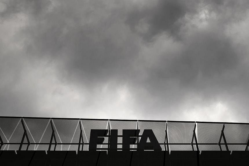 A logo of the Fifa is seen at the top of its headquarters on May 27, 2015 in Zurich. -- PHOTO: AFP