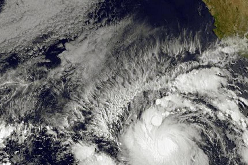 This image obtained from the NOAA-NASA GOES Project shows Tropical Storm Andres (bottom) on May 28, 2015. -- PHOTO: AFP