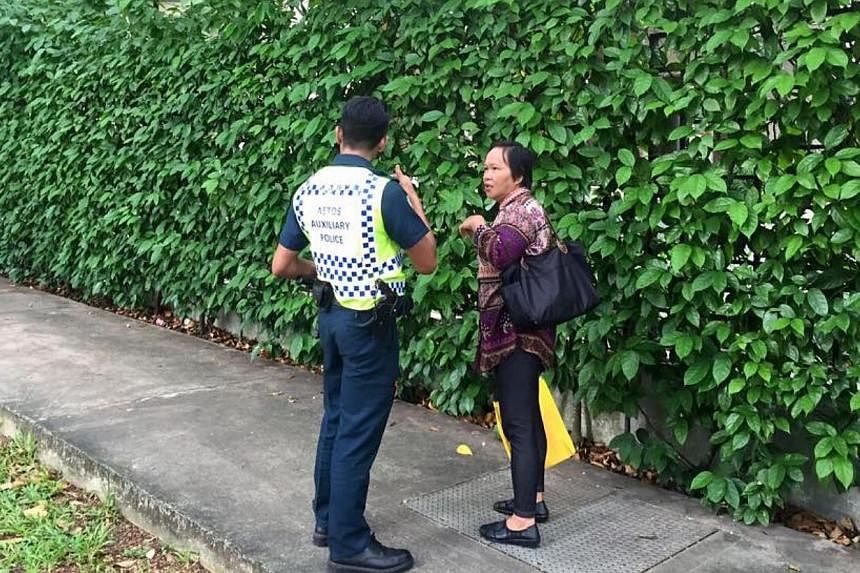A passer-by being turned away by a police officer.&nbsp;Three men travelling in a car dashed through a checkpoint and police barricades near Shangri-La Hotel when police asked to inspect the car boot on Sunday, May 31, 2015. Police fired at the car, 