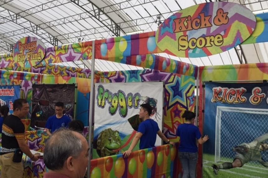 Labour chief Chan Chun Sing announced at a carnival in Pasir Ris on Sunday that the NTUC will be adjusting income caps for two of its voucher schemes so as to benefit more of its members. -- ST PHOTO: AUDREY TAN