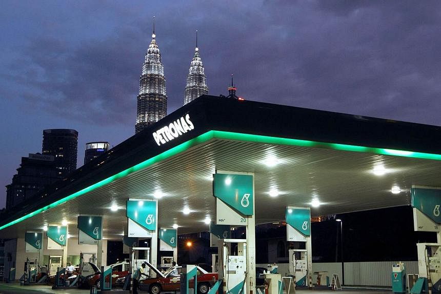 Malaysia's fuel prices will go up at midnight by 10 Malaysian cents across the board.&nbsp;-- PHOTO: BLOOMBERG