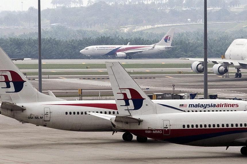 Malaysia Airlines planes are seen at Kuala Lumpur International Airport in Sepang, Selangor, Malaysia, on April 3, 2014. -- PHOTO: EPA