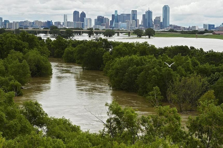 The Trinity River burst its banks in Dallas, Texas, USA, on May 30, 2015. Sunshine and drier weather were forecast for most of flood-weary Texas after days of heavy rain. -- PHOTO: EPA&nbsp;