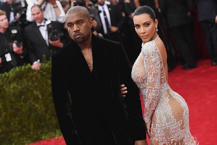 Kanye West (left) and Kim Kardashian at the Metropolitan Museum of Art on May 4, 2015 in New York City. The married couple is expecting their second child. -- PHOTO: AFP