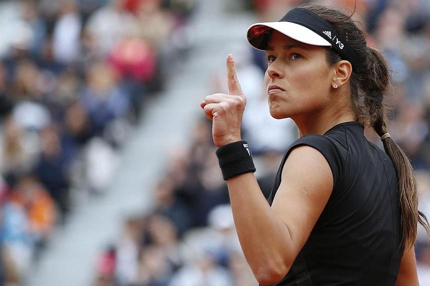 Ana Ivanovic celebrates after winning a point against Russia's Ekaterina Makarova during the women's fourth round of the Roland Garros 2015 French Tennis Open in Paris on Sunday (May 31). PHOTO: AFP