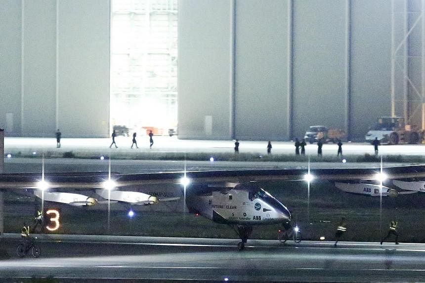 The Solar Impulse 2 touches down at Nagoya airport in Japan on MOnday night (June 1). -- PHOTO: REUTERS