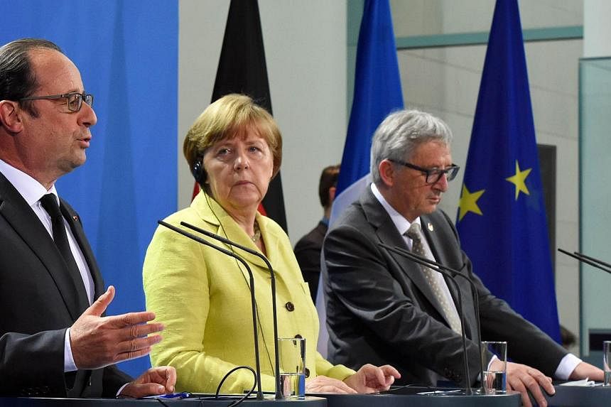 (Left to right) French President Francois Hollande, German Chancellor Angela Merkel and European Commission President Jean-Claude Juncker addressing a press conference prior to talks with representatives of the of the European Round Table of Industri