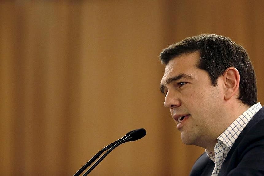 Greece's PM Alexis Tsipras attacked the country's creditors for insisting on what he described as "absurd" reforms which have only held up progress in negotiations for a deal aimed at preventing his country from defaulting. -- PHOTO: AFP