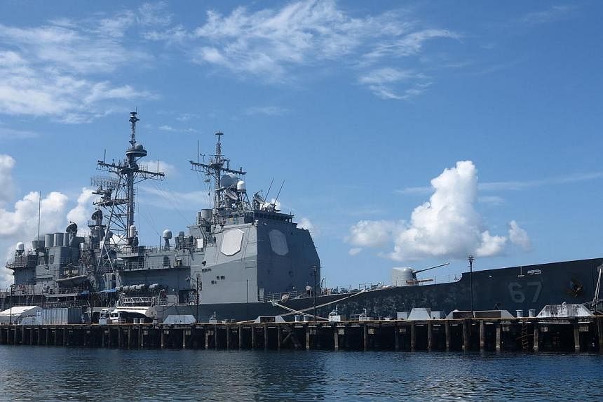 A US warship anchored last Thursday at Subic Bay in the Philippines as part of a military patrol in the South China Sea. The US-China status quo may not be sustainable and could transition to a crisis. A compromise could avoid such a scenario and sho