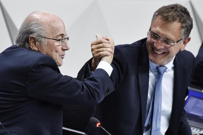 This May 29, 2015 file photograph shows Fifa President Sepp Blatter (left) shaking hands with Fifa general secretary Jerome Valcke (right) during the 65th Fifa Congress in Zurich, Switzerland. -- PHOTO: AFP&nbsp;