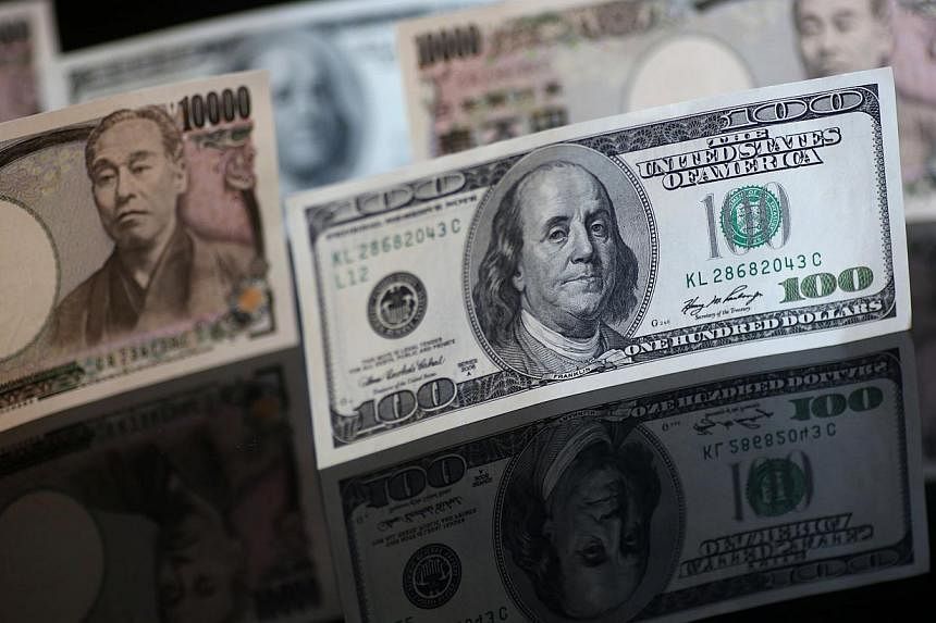 The U.S. dollar hit a more than 12-year high against the yen on Tuesday as upbeat US data reignited talk of an interest rate hike this year. -- PHOTO:&nbsp;BLOOMBERG