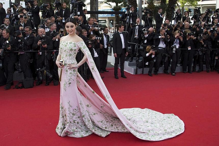 On the same day, Fan was wearing a pink embroidered Ralph &amp; Russo gown. -- PHOTO: REUTERS&nbsp;