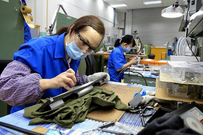 Singapore's manufacturing sector showed some signs of recovery as activity expanded for the first time this year, raising hopes for brighter outlook ahead. -- PHOTO: BUSINESS TIMES&nbsp;
