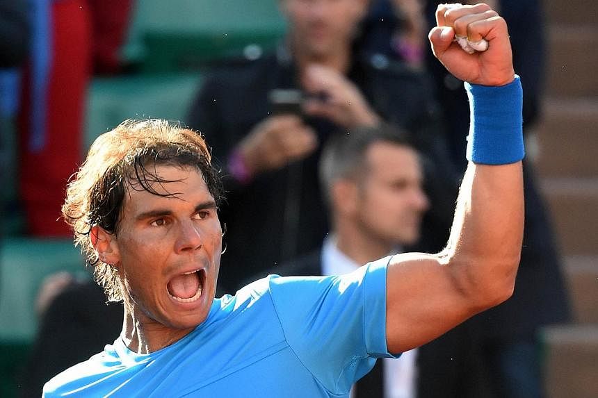 Spain's Rafael Nadal celebrates his victory over Jack Sock of the US at the end of their men's fourth round of the Roland Garros 2015 French Tennis Open in Paris on June 1, 2015.&nbsp;Nadal believes all the pressure will be on Novak Djokovic in Wedne