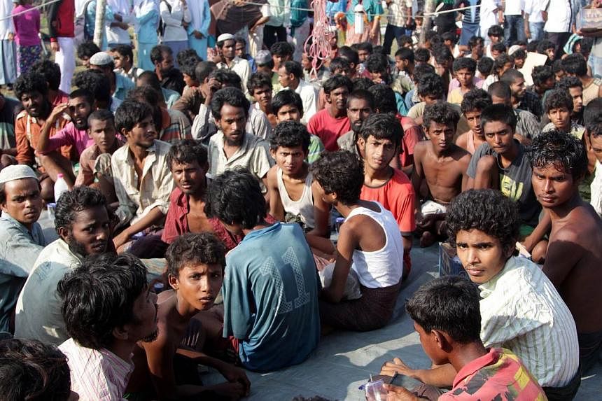 Refugees from Myanmar and Bangladesh are seen in a camp after their rescue by Aceh fisherman in Julok, East Aceh, Sumatra, Indonesia, on May 20, 2015. - PHOTO: AFP