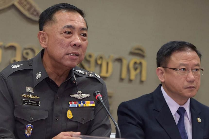 Thai police General Aek Angsananont (left) answers a question from journalists next to Anti-Money Laundering Office secretary-general Seehanat Prayoonrat (right) at police headquarters in Bangkok on June 2, 2015. A&nbsp;Thai court has issued an arres