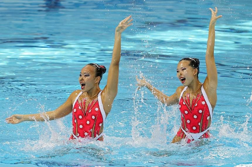 Singapore's Chen Mei Qi, Stephanie (left) and Yap Yu Hui, Crystal compete in the 28th SEA Games synchronised swimming Duet Technical event on Tuesday, June&nbsp;2, 2015, at the OCBC Aquatics Centre. -- ST PHOTO: SEAH KWANG PENG