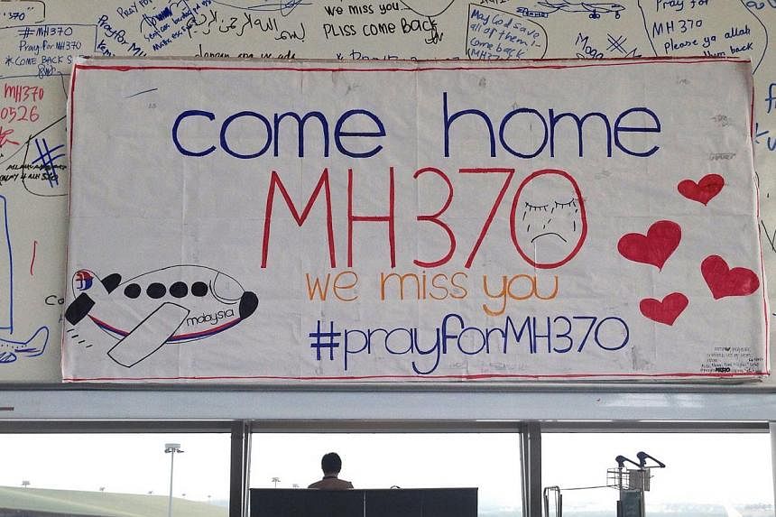 A white board with written prayers at the viewing gallery of Kuala Lumpur International Airport for Malaysia Airlines Flight MH370 after it went missing on March 8,&nbsp;2014. The hunt for missing Malaysia Airlines Flight MH370 will not be expanded b