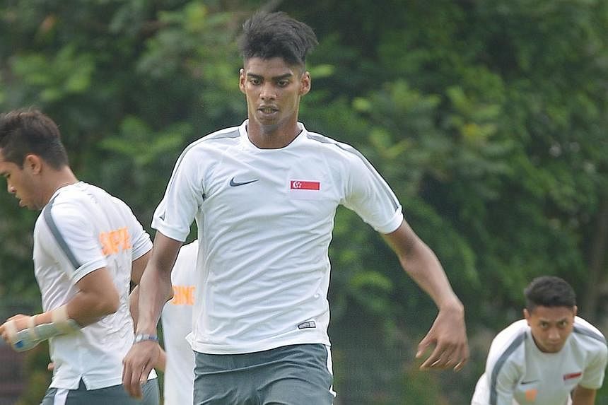 Lions coach Bernd Stange has called up striker Iqbal Hussain (centre) for the World Cup qualifier against Japan, in a move that came just days after he was dropped by Aide Iskander from the SEA Games squad. -- ST PHOTO: ALPHONSUS CHERN