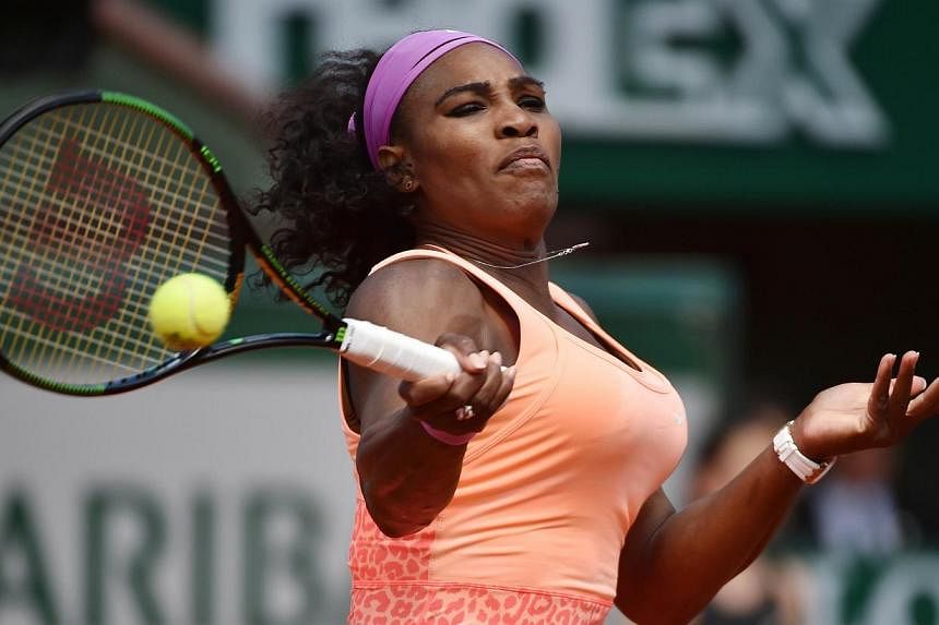 Serena Williams returns to Italy's Sara Errani during their women's quarter final match of the Roland Garros 2015 French Tennis Open in Paris on June 3, 2015. -- PHOTO: AFP