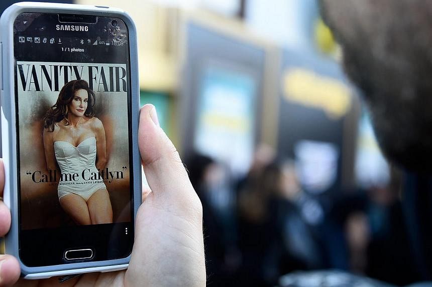 A man viewing the July cover of Vanity Fair featuring Caitlyn Jenner on June 1, 2015. -- PHOTO: AFP&nbsp;