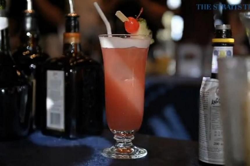 The Singapore Sling, a cocktail that was created at the Raffles Hotel in 1915, celebrates its centennial anniversary this year. -- PHOTO: SCREENGRAB FROM RAZORTV VIDEO
