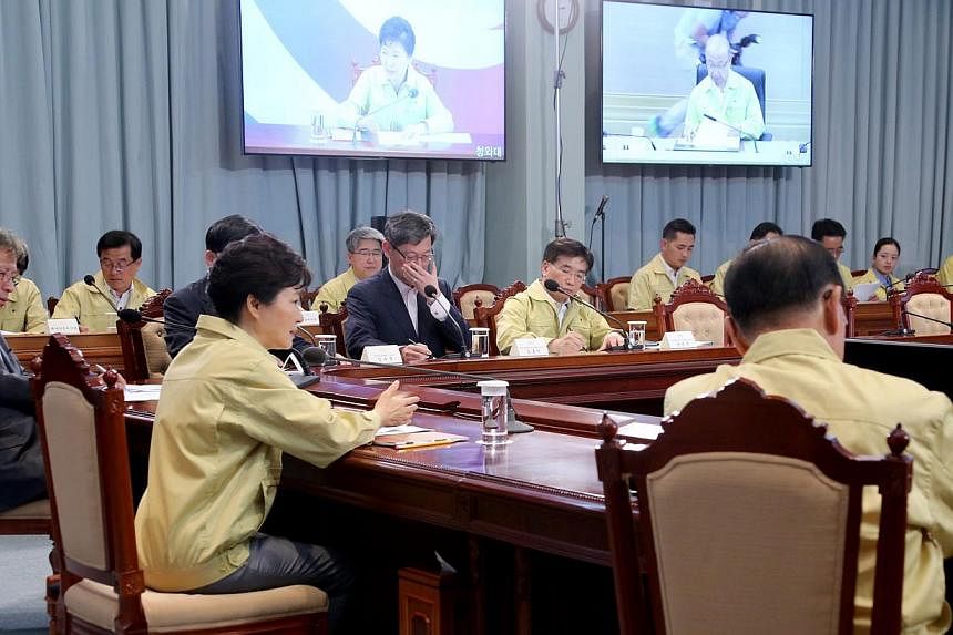 South Korean President Park Geun-hye (second left, front) presides over an emergency meeting at the presidential office Cheong Wa Dae in Seoul, South Korea on June 3, 2015. The meeting focused on measures to contain the Middle East Respiratory Syndro