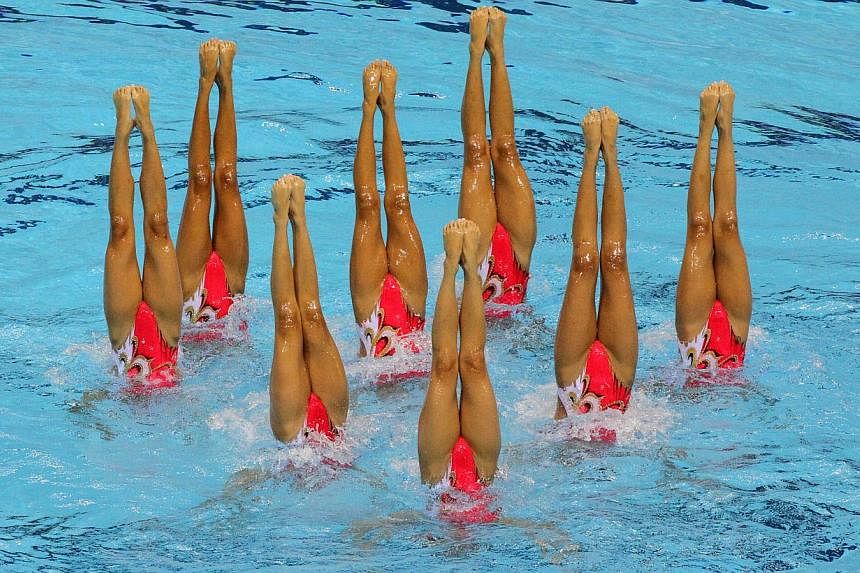 The Singapore synchronised swimming team in action at the 28th SEA Games. -- PHOTO: REUTERS&nbsp;