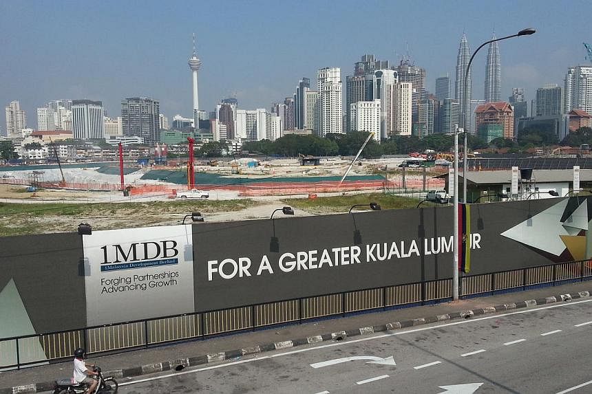 Malaysia's central bank said on Wednesday it had launched a "formal inquiry" into strategic development fund 1Malaysia Development Bhd (1MDB), which is struggling under a huge debt burden and suspicions of massive fraud and mismanagement. -- PHOTO: S